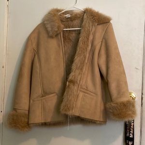 It’s a fur suede nice jacket sort of a brown tan color.